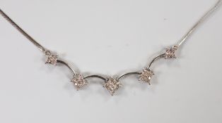 A modern 9ct gold and diamond set quintuple cluster necklace, 46cm, gross weight 3.9 grams.