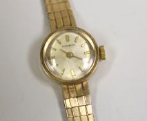 A lady's 9ct gold Longines manual wind wrist watch, 15cm, gross weight 16.5 grams, with a Longines