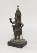 An early 20th century bronze figural match holder, on slate plinth, 20cm