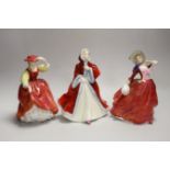 Three Royal Doulton figures: Rachel HN2936, Buttercup HN2399, Autumn Breezes HN1934, tallest 20cm