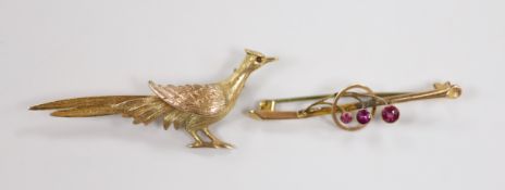 A 1960's 9ct gold pheasant brooch, 60mm and an earlier 9ct and gem set bar brooch, gross weight 7.