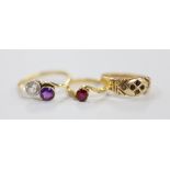 An 18ct, amethyst and simulated diamond set crossover ring, an 18ct and red stone ring, gross weight