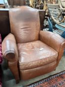 A contemporary tan leather reclining armchair with integral footrest, width 92cm, height 104cm