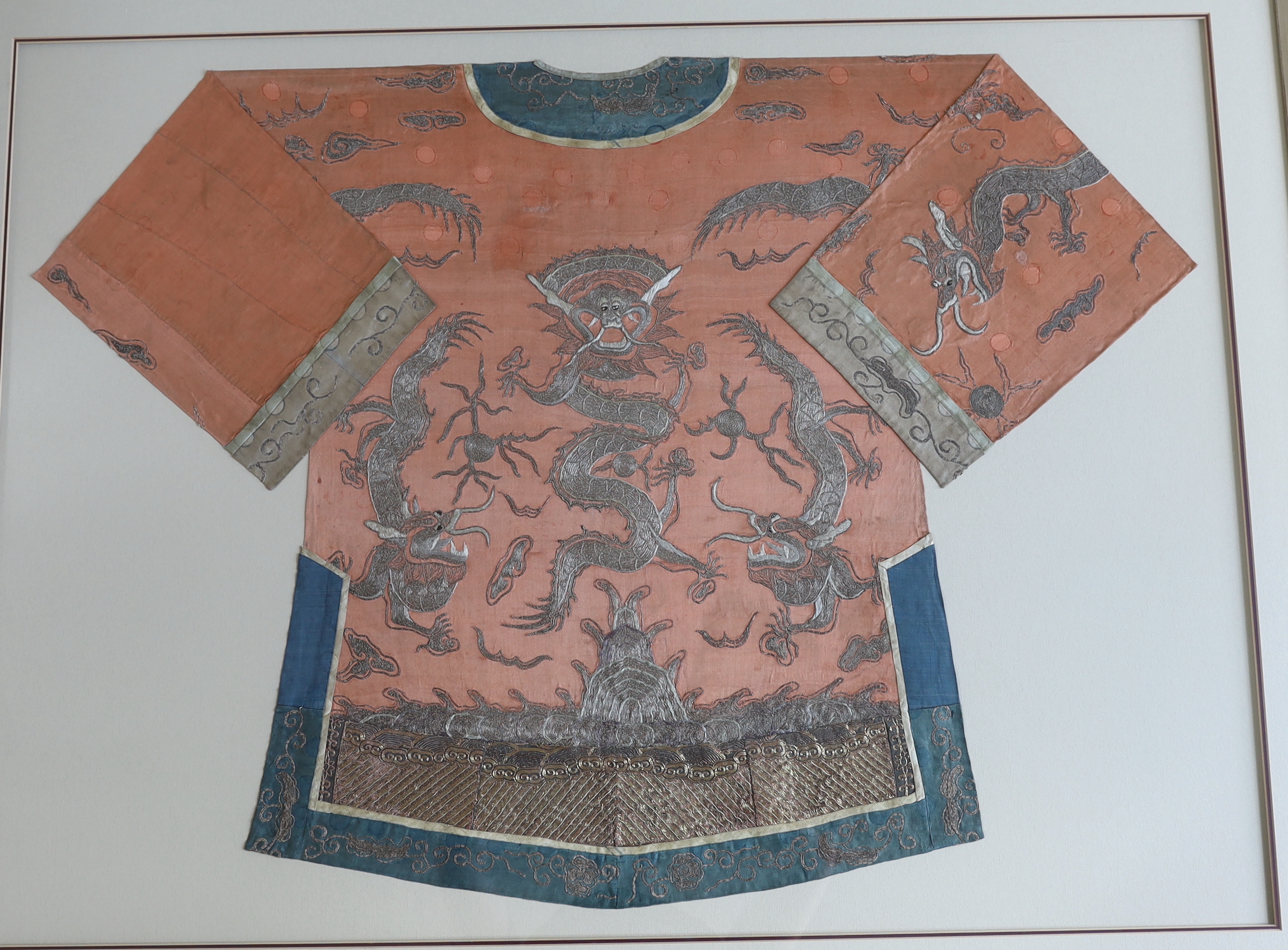A late 19th century Chinese coral silk and silver metallic embroidered dragon robe, the dragons - Image 2 of 3