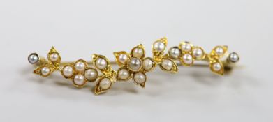 An Edwardian yellow metal and split pearl set foliate bar brooch, 50mm, gross weight 4.5 grams.