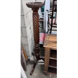 A Victorian style mahogany torchere, height 135cm