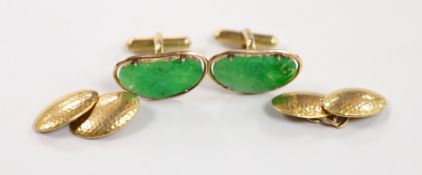 A pair of Chinese yellow metal mounted carved green jade cufflinks, 23mm, together with a further