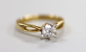 A yellow metal and solitaire diamond ring, size O, gross weight 4.2 grams, the stone weighing