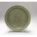 A Chinese celadon glazed 'twin fish' dish, 30cm diameter