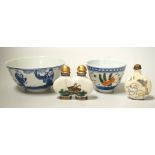 A 19th century Chinese blue and white bowl, an enamelled goldfish cup and two snuff bottles