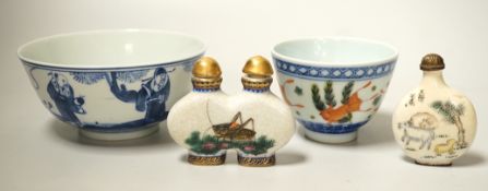 A 19th century Chinese blue and white bowl, an enamelled goldfish cup and two snuff bottles