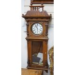 A weight driven Vienna walnut wall clock
