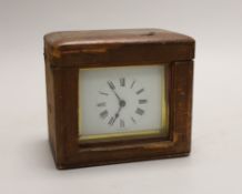 A small French brass carriage clock, 11cm, in leather case