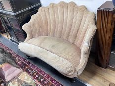 A Victorian scallop shell shaped two seater settee on turned tapered feet, length 127cm, depth 81cm,