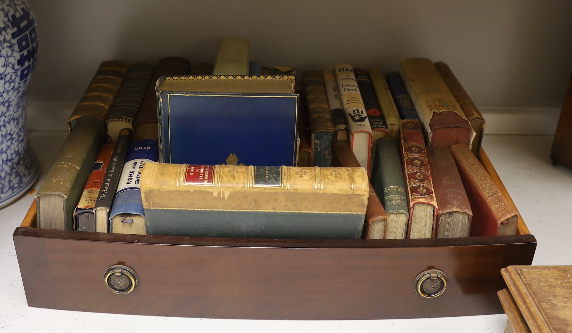 ° ° A small quantity of assorted books including some leather bindings