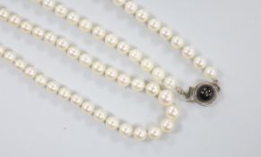 Two modern single strand cultured pearl necklaces, both with 750 white metal clasps, one with star