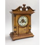 A 19th century Black Forest inlaid walnut mantel clock, 37cm high