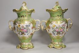 A pair of Rockingham style porcelain pot pourri vases, each of rococo form painted to each side with