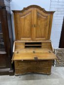 A 19th century Continental walnut bureau cabinet, width 105cm, depth 57cm, height 188cm