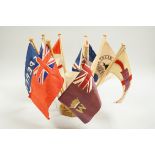 A collection of shipping flags on a stand and a boxed silver oar, engraved: 2nd, Destroyer