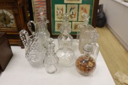 A quantity of cut glass decanters and jugs
