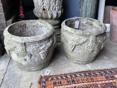 A pair of circular reconstituted stone garden planters, diameter 37cm, height 31cm