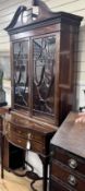 An Edwardian marquetry inlaid mahogany serpentine display cabinet, (bears Edwards & Roberts