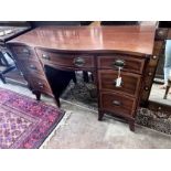 A reproduction 'Drexel Furniture' serpentine mahogany kneehole dressing table, width 117cm, width