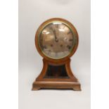 A late 19th century balloon mantel clock with silvered dial, 41cm