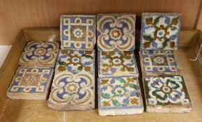 A group of eleven 17th century Spanish polychrome tiles, 8cm square, varying thicknesses