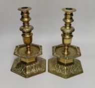 A pair of 19th century Scandinavian candlesticks, each with hexagonal domed bell base cast with