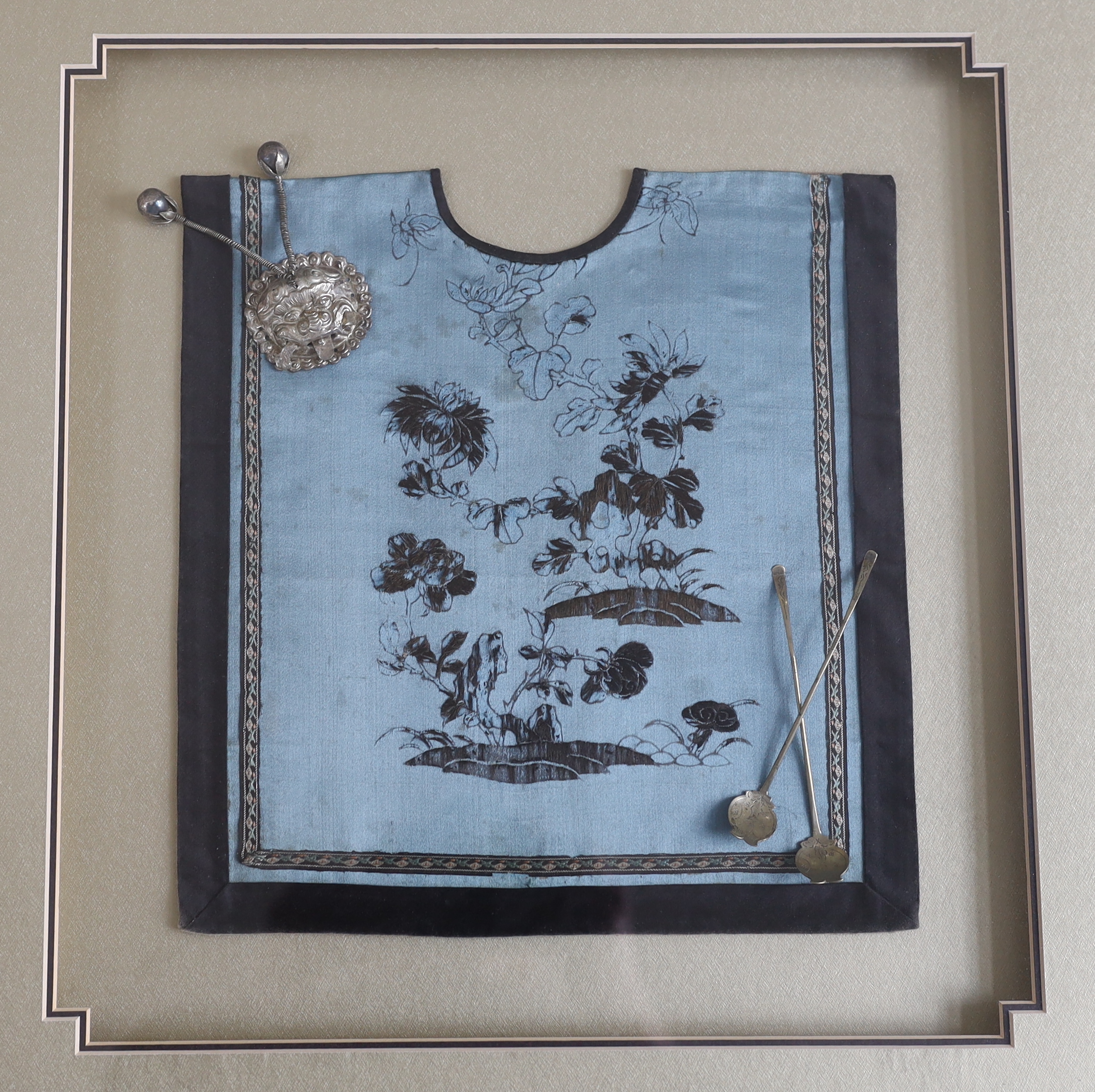 A late 19th century Chinese silk and blue floral embroidered baby’s bib, mounted with two white - Image 2 of 3