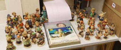 A collection of Hummel / Goebel figures