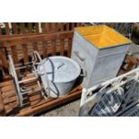 A vintage galvanised square grain bin, height 55cm, a circular lidded container and a hose reel