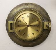 A brass porthole clock with Jaeger Le Coutre dial, total diameter 24cm