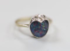 An 18ct white gold, black opal doublet and three stone diamond set ring, size F, gross weight 3