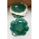 Sixteen Wedgwood green-glazed leaf plates and similar serving plate, latter 25cm