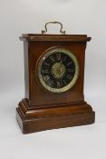 A late 19th century mahogany mantel clock with ebonised dial, 37cm