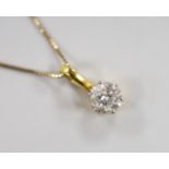 A yellow metal and solitaire diamond set pendant, 15mm, on a 9ct chain, 42cm, gross weight 2.7