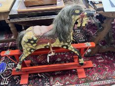 A rocking horse, width 108cm, height 90cm