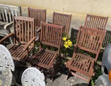 Six (5 + 1) stained teak folding garden chairs, two with arms