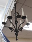 A wrought iron six light chandelier