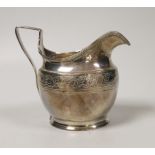 A George III engraved silver helmet shaped cream jug, Andrew Fogelburg, London, 1801, height 10.2cm,