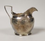 A George III engraved silver helmet shaped cream jug, Andrew Fogelburg, London, 1801, height 10.2cm,