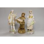 A pair of 19th century German porcelain figures, 22cm, and another