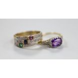 A yellow metal, and single stone amethyst set ring, with diamond chip set shoulders, size O and a