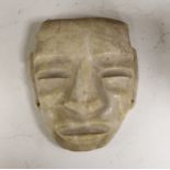 A South American marble ‘face’ carving, 19.5cm