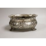 An ornate late 19th century German embossed silver oval fruit bowl, with pierced scroll feet, import