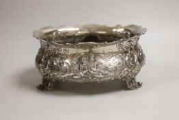 An ornate late 19th century German embossed silver oval fruit bowl, with pierced scroll feet, import