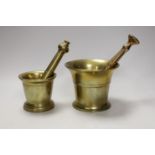Two brass pestle and mortars, largest mortar 11.5cm tall